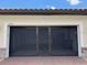 View of garage with screen, epoxy flooring, and brick-paved driveway at 1263 Cicely Ct, North Port, FL 34289