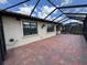 Covered brick patio with privacy fence at 1263 Cicely Ct, North Port, FL 34289