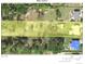 Aerial view of a property highlighting lot dimensions and nearby surroundings at 1270 Manor Rd, Englewood, FL 34223