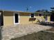 Backyard with paver patio and lounge chairs at 1270 Manor Rd, Englewood, FL 34223