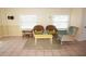 Living room with tile floors, wicker chairs, and a coffee table at 1270 Manor Rd, Englewood, FL 34223