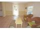 Bright living room with tile floors, neutral paint, and casual seating area at 1270 Manor Rd, Englewood, FL 34223