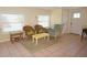 Inviting living room with tile floors and comfortable seating with plenty of natural light at 1270 Manor Rd, Englewood, FL 34223