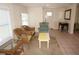 Open-concept living room featuring tile floors, wicker chairs and comfortable seating at 1270 Manor Rd, Englewood, FL 34223