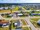 Aerial view of a neighborhood featuring single Gathering homes in a well kept suburban environment at 13575 Clara Ln, Port Charlotte, FL 33981