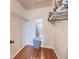 Walk-in closet features wood flooring, wire shelving, and a view into another room at 13575 Clara Ln, Port Charlotte, FL 33981