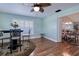 Inviting dining area featuring hardwood floors and a view into an adjacent dining area at 13575 Clara Ln, Port Charlotte, FL 33981
