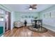 Cozy dining area with unique ceiling fan, breakfast table, and a sliding door to an outdoor patio at 13575 Clara Ln, Port Charlotte, FL 33981
