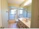 Bright bathroom featuring a shower, toilet, and vanity at 1497 Fireside St, Port Charlotte, FL 33952
