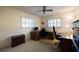Bedroom with desk and ceiling fan with blinds on the windows at 1497 Fireside St, Port Charlotte, FL 33952