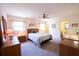 Serene main bedroom with a ceiling fan, soft lighting, and a comfortable bed at 1497 Fireside St, Port Charlotte, FL 33952