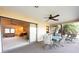 Screened patio with ceiling fans and seating to enjoy the weather at 1497 Fireside St, Port Charlotte, FL 33952