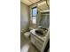 Bathroom showcasing a toilet, vanity with sink, and a shower with sliding glass doors at 18054 Ackerman Ave, Port Charlotte, FL 33948