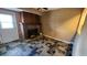 Bonus room with fireplace featuring interesting flooring and access to backyard at 18054 Ackerman Ave, Port Charlotte, FL 33948