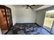 Bonus room offering a sliding door, interesting flooring and lots of natural light at 18054 Ackerman Ave, Port Charlotte, FL 33948