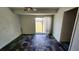 Bonus room offering a sliding door, interesting flooring and lots of natural light looking out into backyard at 18054 Ackerman Ave, Port Charlotte, FL 33948