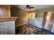 Cozy dining area featuring a brick fireplace and tile floors, perfect for intimate meals at 18054 Ackerman Ave, Port Charlotte, FL 33948