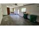 Large garage with utility sink, laundry area, and access to the backyard at 18054 Ackerman Ave, Port Charlotte, FL 33948
