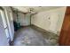 Spacious garage with a roll-up door offers ample storage and parking at 18054 Ackerman Ave, Port Charlotte, FL 33948