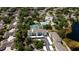 Aerial view of community featuring the condominiums, pool and tennis courts at 19385 Water Oak Dr # 302, Port Charlotte, FL 33948