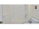 Clean bathroom showcasing a tiled shower-tub and a functional, space-saving design at 19385 Water Oak Dr # 302, Port Charlotte, FL 33948