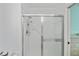 The bathroom has a clear glass shower with updated showerhead fixtures and handheld sprayer at 19385 Water Oak Dr # 302, Port Charlotte, FL 33948