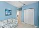 Bedroom featuring a ceiling fan, closet, natural light, and comfortable seating at 19385 Water Oak Dr # 302, Port Charlotte, FL 33948