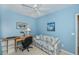 Bedroom featuring a ceiling fan, natural light, a workspace, and comfortable seating at 19385 Water Oak Dr # 302, Port Charlotte, FL 33948