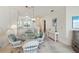 Bright dining area with a glass table and view into the kitchen and living space at 19385 Water Oak Dr # 302, Port Charlotte, FL 33948