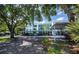 Condominium with assigned covered parking and tropical landscaping at 19385 Water Oak Dr # 302, Port Charlotte, FL 33948