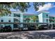 Beautiful condominium building with lush landscaping and covered parking at 19385 Water Oak Dr # 302, Port Charlotte, FL 33948