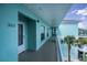 Exterior view of the condo, featuring bright color scheme and balcony at 19385 Water Oak Dr # 302, Port Charlotte, FL 33948