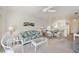 Relaxing living room with open layout to kitchen and light color scheme at 19385 Water Oak Dr # 302, Port Charlotte, FL 33948