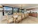 Elegant dining room with a large table, seating for twelve, and views of the pool area at 200 Capri Isles Ct, Punta Gorda, FL 33950