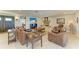 Comfortable living room with stylish furnishings, a cozy fireplace, and an inviting open layout for relaxation and entertainment at 200 Capri Isles Ct, Punta Gorda, FL 33950