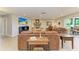 Bright and spacious living room features a charming fireplace, comfortable seating, and ample natural light at 200 Capri Isles Ct, Punta Gorda, FL 33950