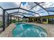 Private pool with a screened enclosure, patio area, and picturesque backyard at 200 Capri Isles Ct, Punta Gorda, FL 33950