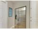 A stainless-steel refrigerator, storage cabinets, and beach-themed décor are featured in this home at 200 Capri Isles Ct, Punta Gorda, FL 33950