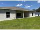 The home features a large backyard with a covered lanai at 20241 Lorette Ave, Port Charlotte, FL 33954