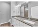 Bathroom featuring granite counters, double sinks, and a shower at 20241 Lorette Ave, Port Charlotte, FL 33954