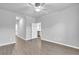 Spacious bedroom boasts a ceiling fan and light gray walls complemented by wood-look flooring at 20241 Lorette Ave, Port Charlotte, FL 33954