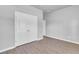 Bedroom with a closet features a closet and neutral walls complemented by wood-look flooring at 20241 Lorette Ave, Port Charlotte, FL 33954