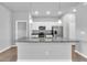 Modern kitchen island with granite countertops, pendant lighting, and stainless steel appliances at 20241 Lorette Ave, Port Charlotte, FL 33954