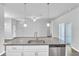 Kitchen island featuring granite countertops, modern stainless steel appliances and an open concept floorplan at 20241 Lorette Ave, Port Charlotte, FL 33954