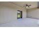 Covered lanai with ceiling fan and sliding glass door to the backyard at 20241 Lorette Ave, Port Charlotte, FL 33954
