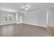 Spacious living area with ample natural light, hardwood floors and modern ceiling fixtures at 20241 Lorette Ave, Port Charlotte, FL 33954