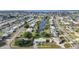 Scenic aerial panorama of a waterfront neighborhood, featuring canal access and neat landscaping at 21249 Higgs Dr, Port Charlotte, FL 33952