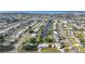 Stunning aerial view of a community with canal access, showcasing waterfront homes and manicured lawns at 21249 Higgs Dr, Port Charlotte, FL 33952