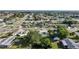 Expansive aerial view showcasing a neighborhood with well-maintained homes and lush landscaping at 21249 Higgs Dr, Port Charlotte, FL 33952