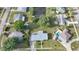 Aerial view of the property in a residential area with nearby canal access and landscaping at 21249 Higgs Dr, Port Charlotte, FL 33952